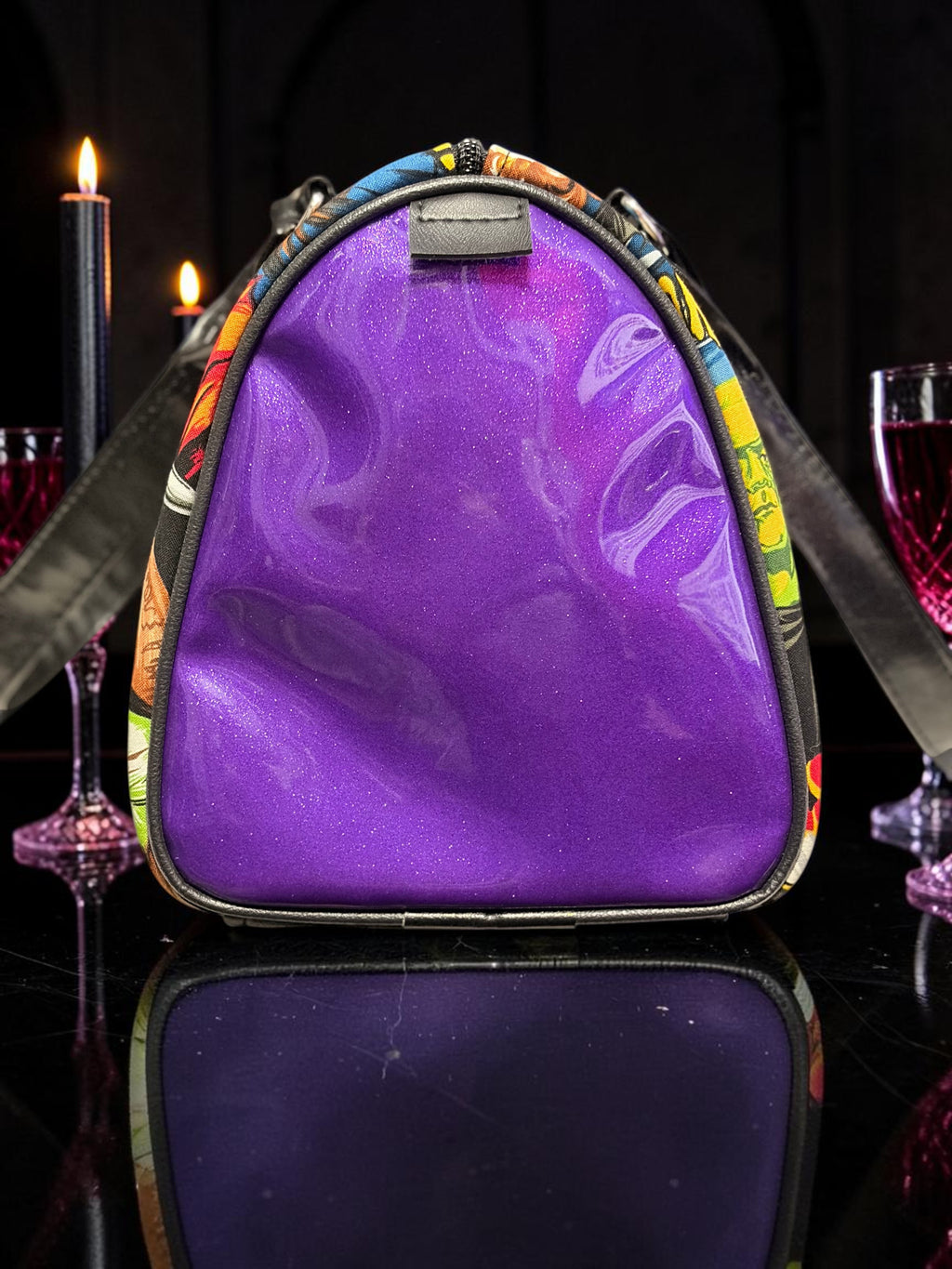 Halloween-Emporium purple glitter horror handbag with a glossy finish and vintage comic book print side panels