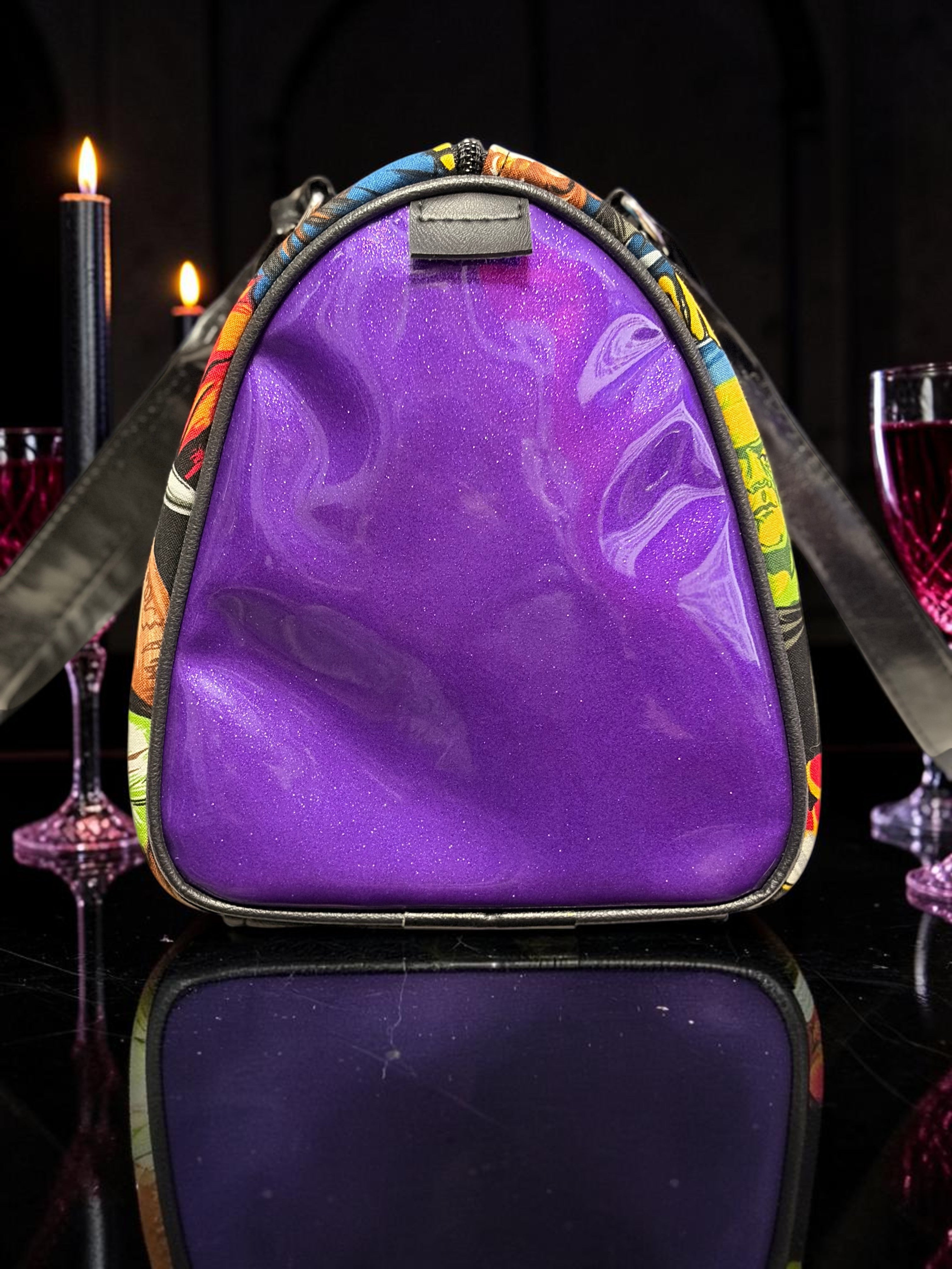 Halloween-Emporium purple glitter horror handbag with a glossy finish and vintage comic book print side panels
