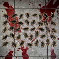 Halloween-Emporium realistic brown plastic cockroach props scattered on a blood-splattered tiled floor