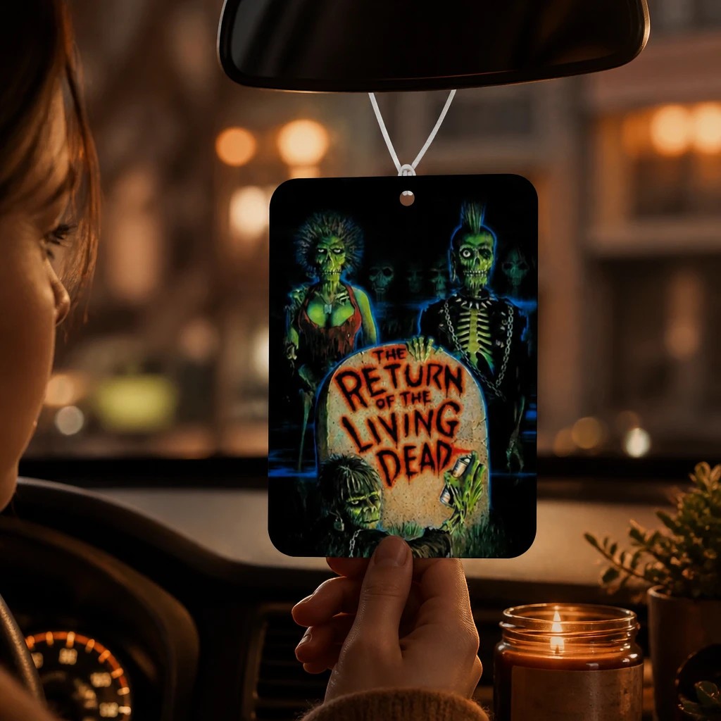 Halloween-Emporium Return of the Living Dead car air freshener with blue lotus scent hanging from a rearview mirror