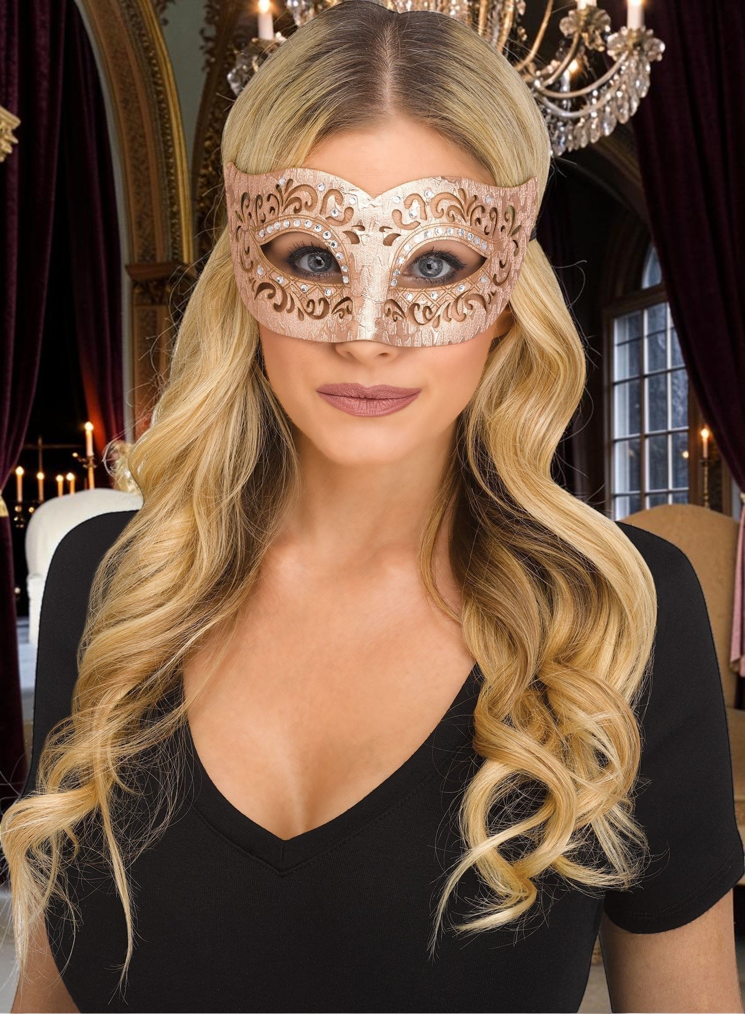 Halloween-Emporium Venetian masquerade mask in rose gold with laser-cut filigree and rhinestones worn by a blonde woman.