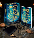 Halloween-Emporium Runes book and card deck kit with 25 engraved stones, velvet pouch, and guide book on wooden table.