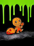 Halloween-Emporium Trick 'r' Treat Sam enamel pin with pumpkin lollipop and candy sack on a spooky black background.