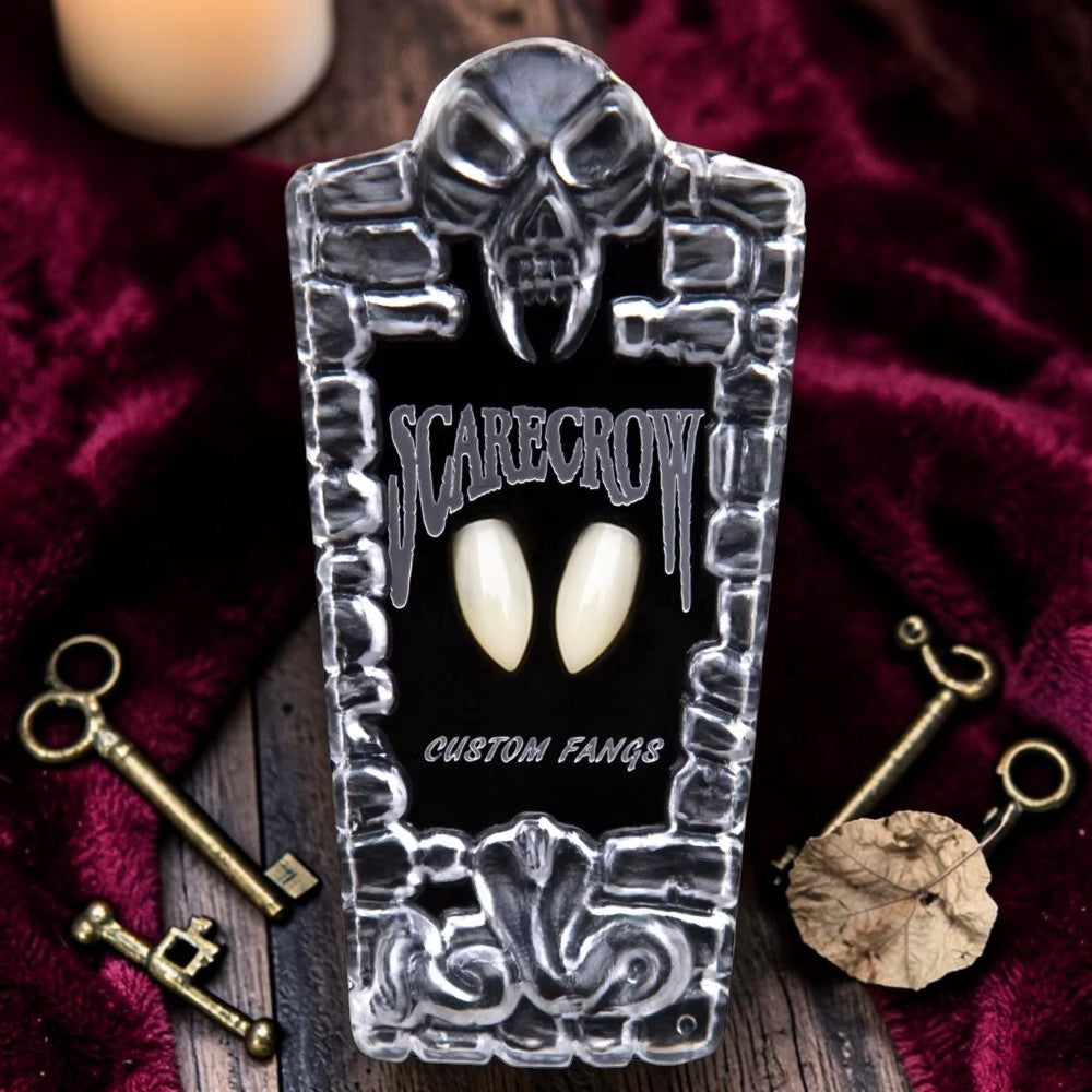Halloween-Emporium Scarecrow Classic Deluxe vampire fangs in a coffin-shaped display case with keys on velvet.
