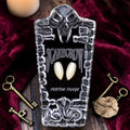 Halloween-Emporium Scarecrow Classic Deluxe vampire fangs in a coffin-shaped display case with keys on velvet.