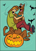Halloween-Emporium Scooby Doo and Shaggy magnet featuring the duo scared on a jack-o'-lantern with bats on teal background