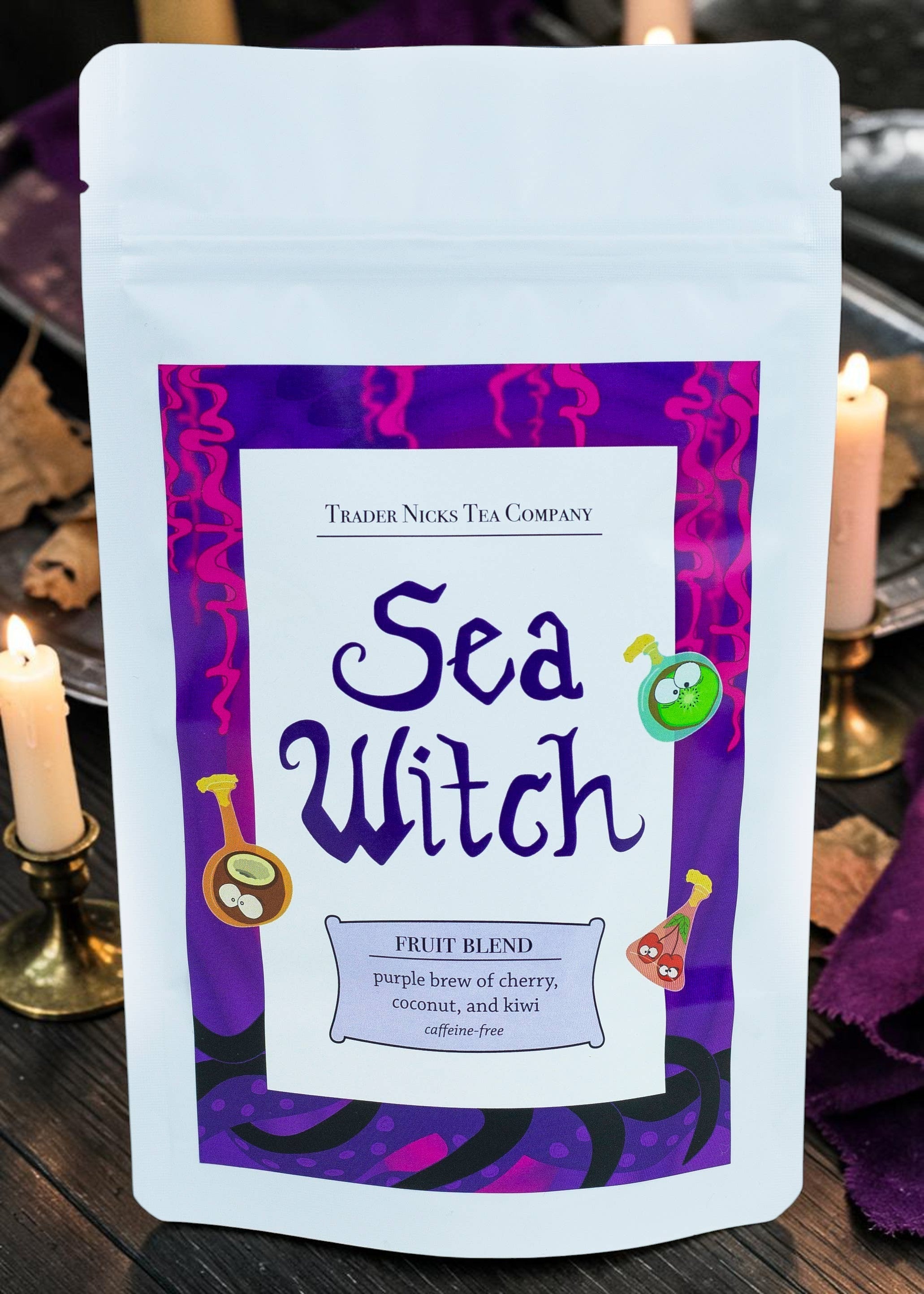 Halloween-Emporium Sea Witch fruit tea pouch featuring cherry, coconut, and kiwi illustrations on a purple label.