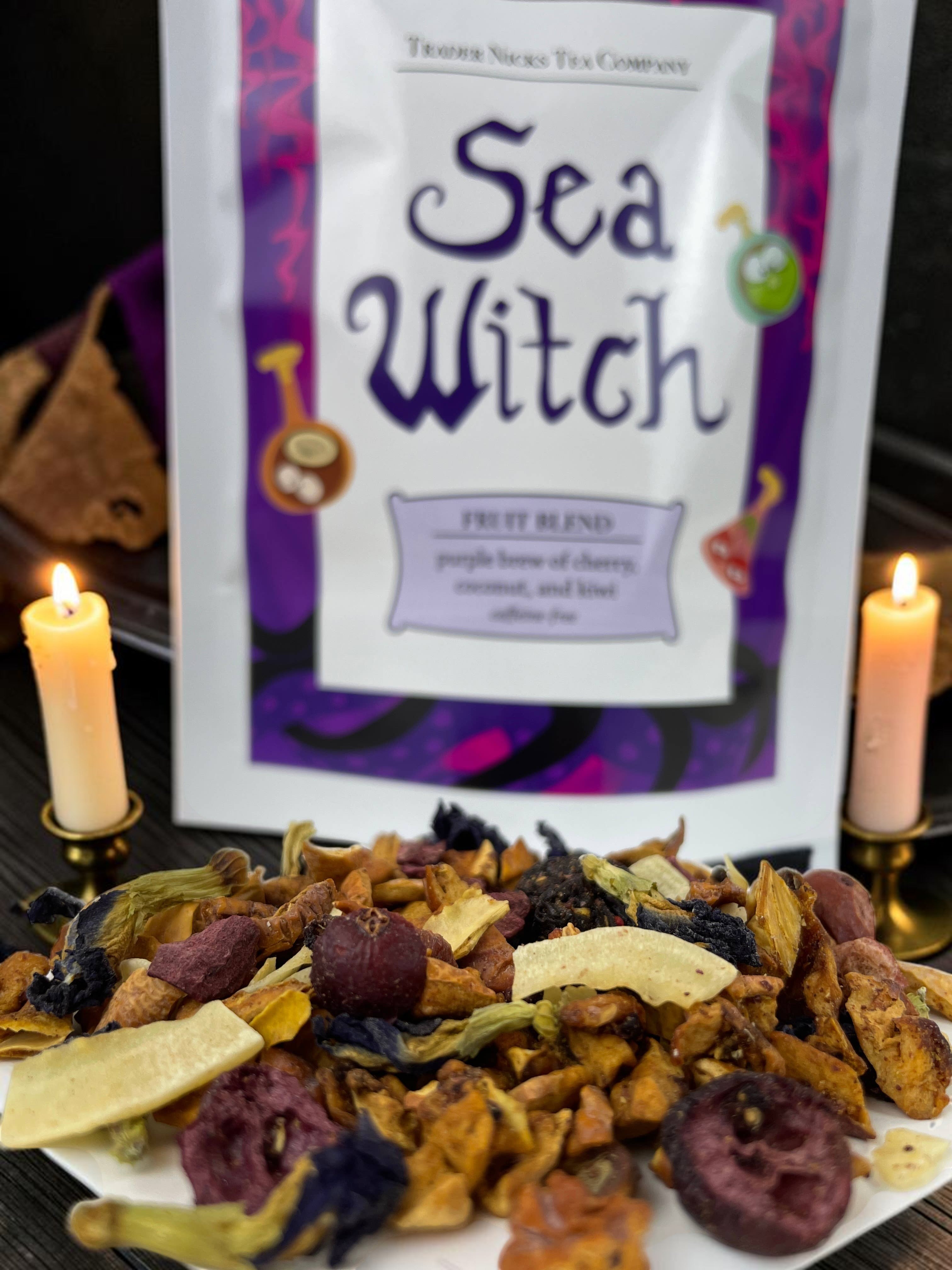 Halloween-Emporium Sea Witch fruit tea blend with dried cherries, coconut, and butterfly pea blossoms in front of a pouch