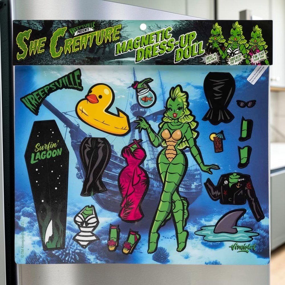 Halloween-Emporium She Creature dress up magnet set featuring a green sea monster doll with outfits and accessories.