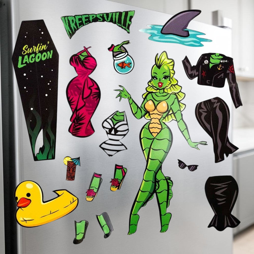 Halloween-Emporium Kreepsville She Creature dress up magnet set featuring a green sea monster and various outfits.