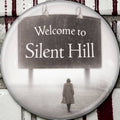 Halloween-Emporium Silent Hill 2006 movie poster round lapel pin featuring a woman walking toward a welcome sign.