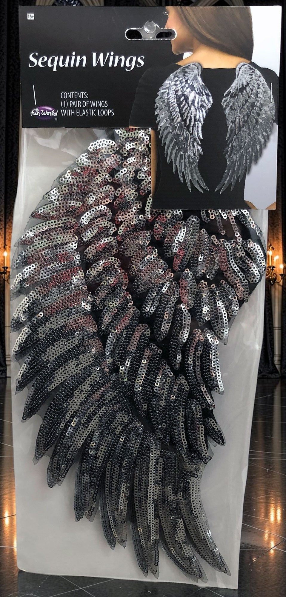 Halloween-Emporium silver sequin angel wings costume accessory with elastic shoulder loops in retail packaging
