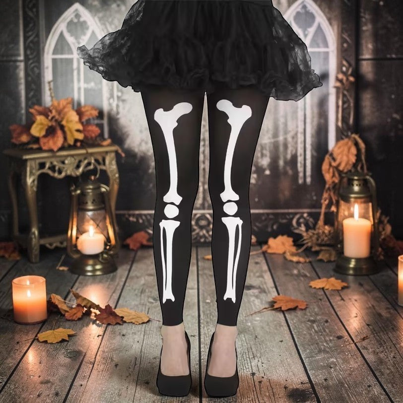 Halloween-Emporium black opaque tights with a white skeleton leg bone print worn with a black tutu and heels.