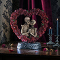 Halloween-Emporium Love Never Dies resin figurine featuring two skeletons embracing inside a red rose heart on a base.