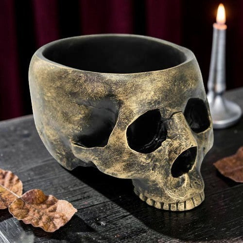 Halloween-Emporium decorative resin skull bowl with a weathered antique gold and black finish for spooky table decor.