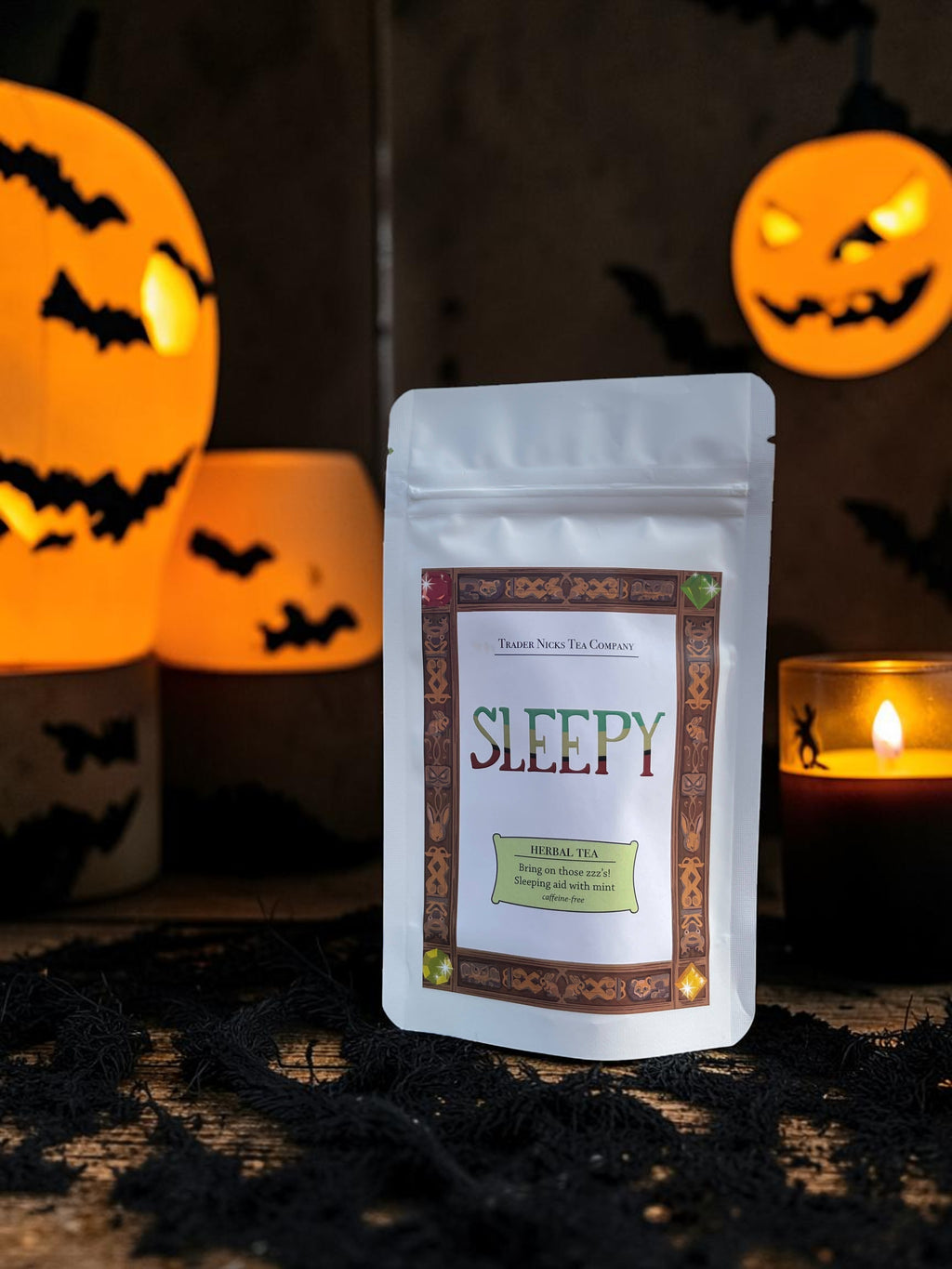 Halloween-Emporium Sleepy Wellness herbal tea pouch with chamomile and peppermint in a spooky Halloween setting.