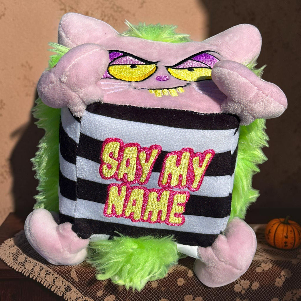 Halloween-Emporium spooky plush character pillow with lavender body, neon green faux fur, and Say My Name graphic.