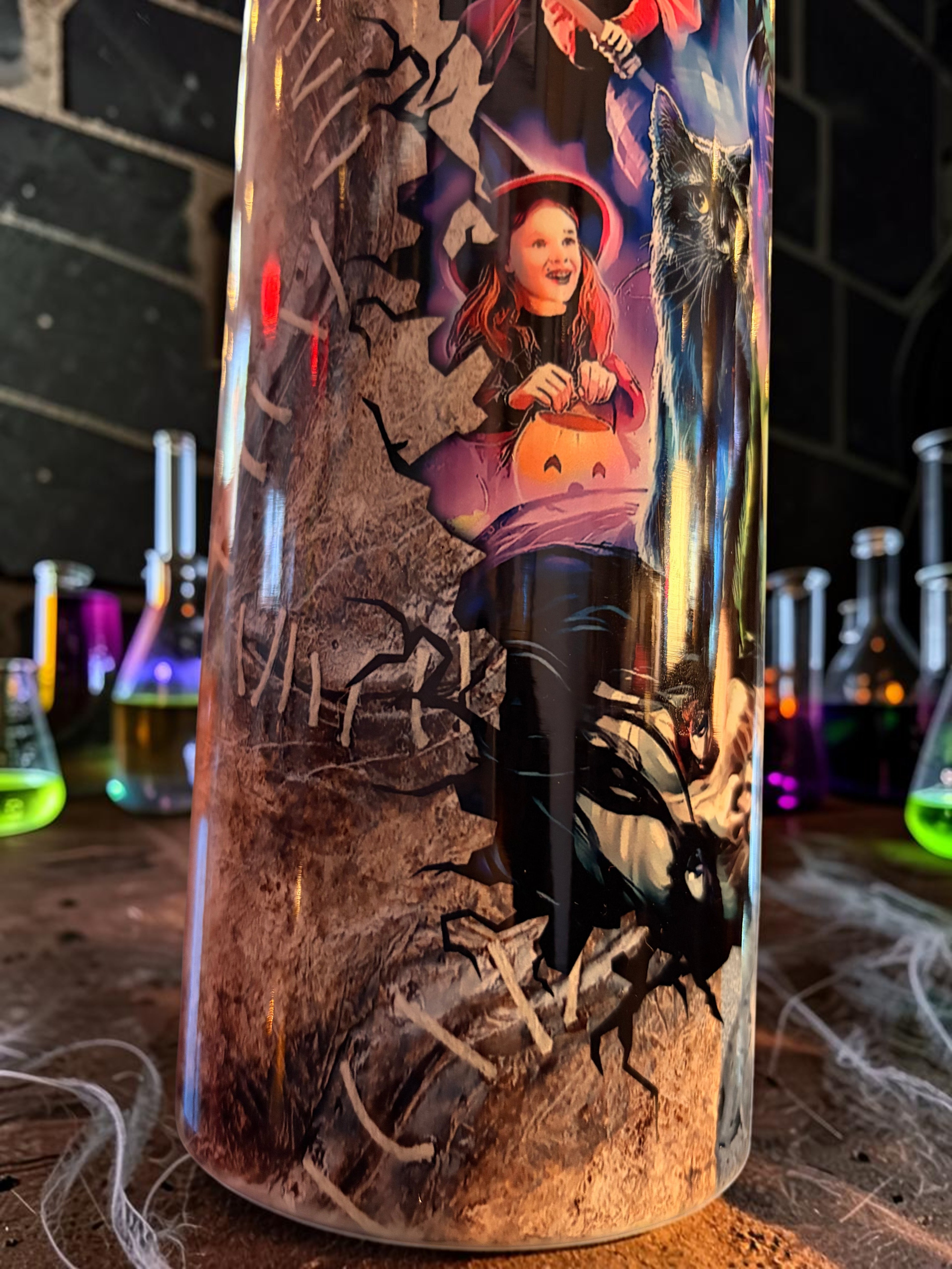 Halloween-Emporium 30oz tumbler featuring a spooky sisterly trio illustration with a black cat and witch theme.