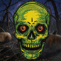 Halloween-Emporium embroidered iron-on patch featuring a neon yellow and green skull with piercing orange eyes.