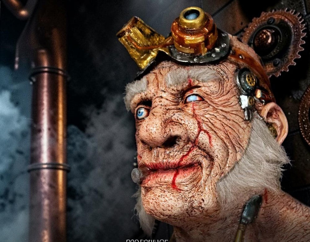Halloween-Emporium Doctor Thaddeus steampunk mask with brass goggles, weathered skin, and faux hair in a lab setting.