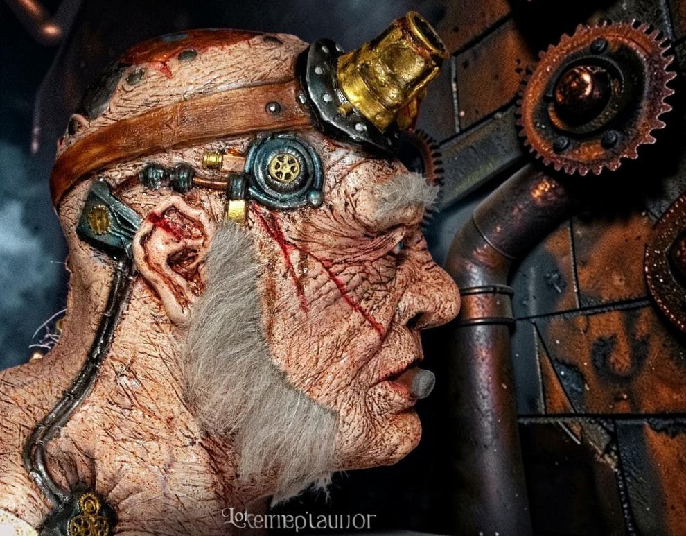 Halloween-Emporium Doctor Thaddeus Tinkers steampunk latex mask with brass goggles, weathered skin, and faux hair.
