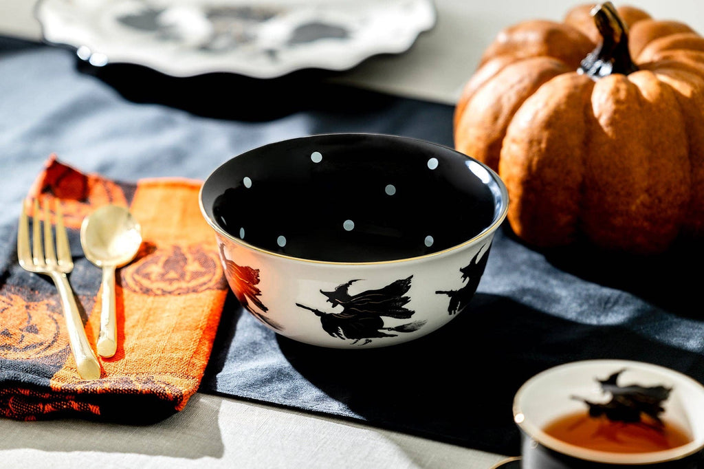 Halloween-Emporium 6.5-inch stoneware bowl with white exterior, witch silhouettes, and black interior with polka dots.