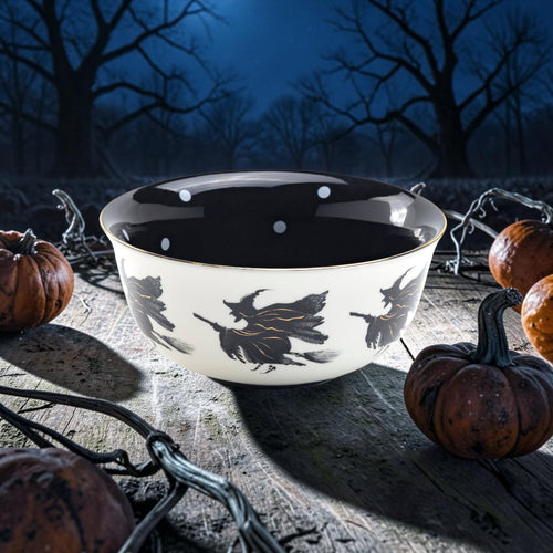 Halloween-Emporium 6.5-inch stoneware bowl with flying witch silhouettes, black interior with white polka dots, and gold rim.