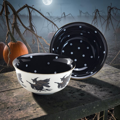 Halloween-Emporium 6.5-inch stoneware bowl with white exterior, flying witch silhouettes, and black polka dot interior.