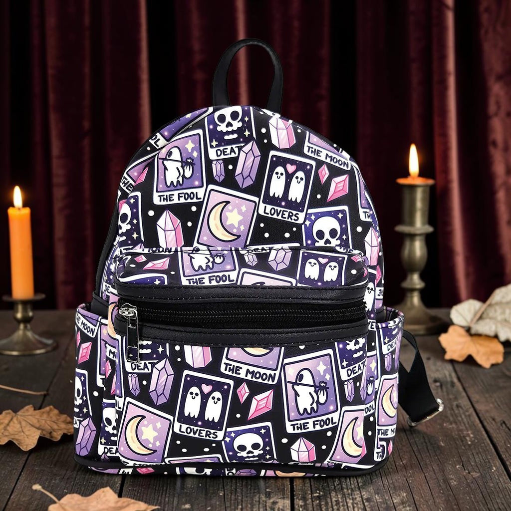 Halloween-Emporium mini backpack featuring a purple and black tarot card pattern with ghosts, skulls, and crystals.