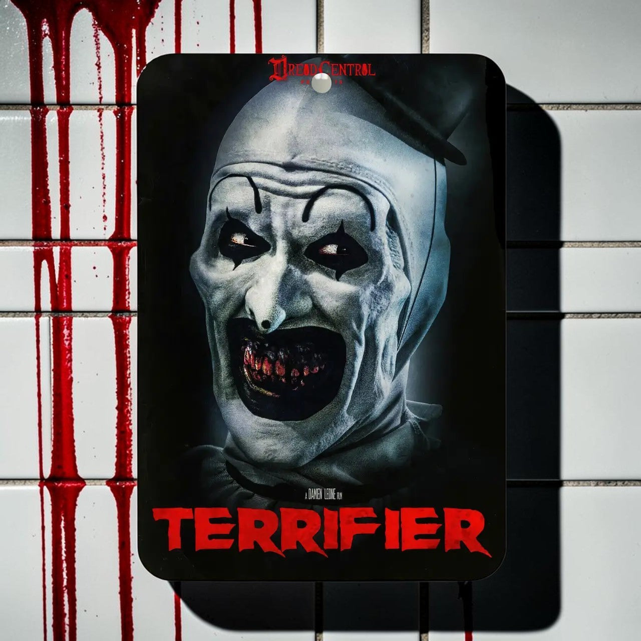 Halloween-Emporium Terrifier air freshener featuring Art the Clown with a coconut vanilla scent for car interiors.