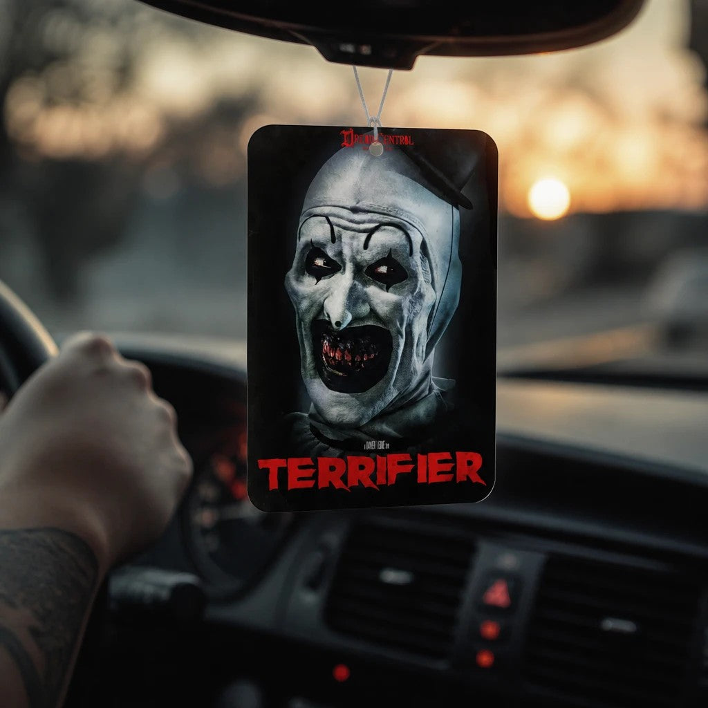 Halloween-Emporium Terrifier Art the Clown hanging car air freshener with a coconut vanilla scent in a vehicle