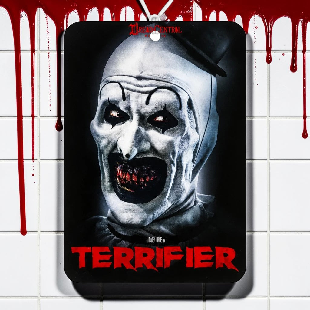 Halloween-Emporium Terrifier air freshener featuring Art the Clown with a coconut vanilla scent on a tiled background.