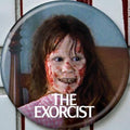 Halloween-Emporium The Exorcist Regan blood button featuring a 1.25-inch round horror movie design.
