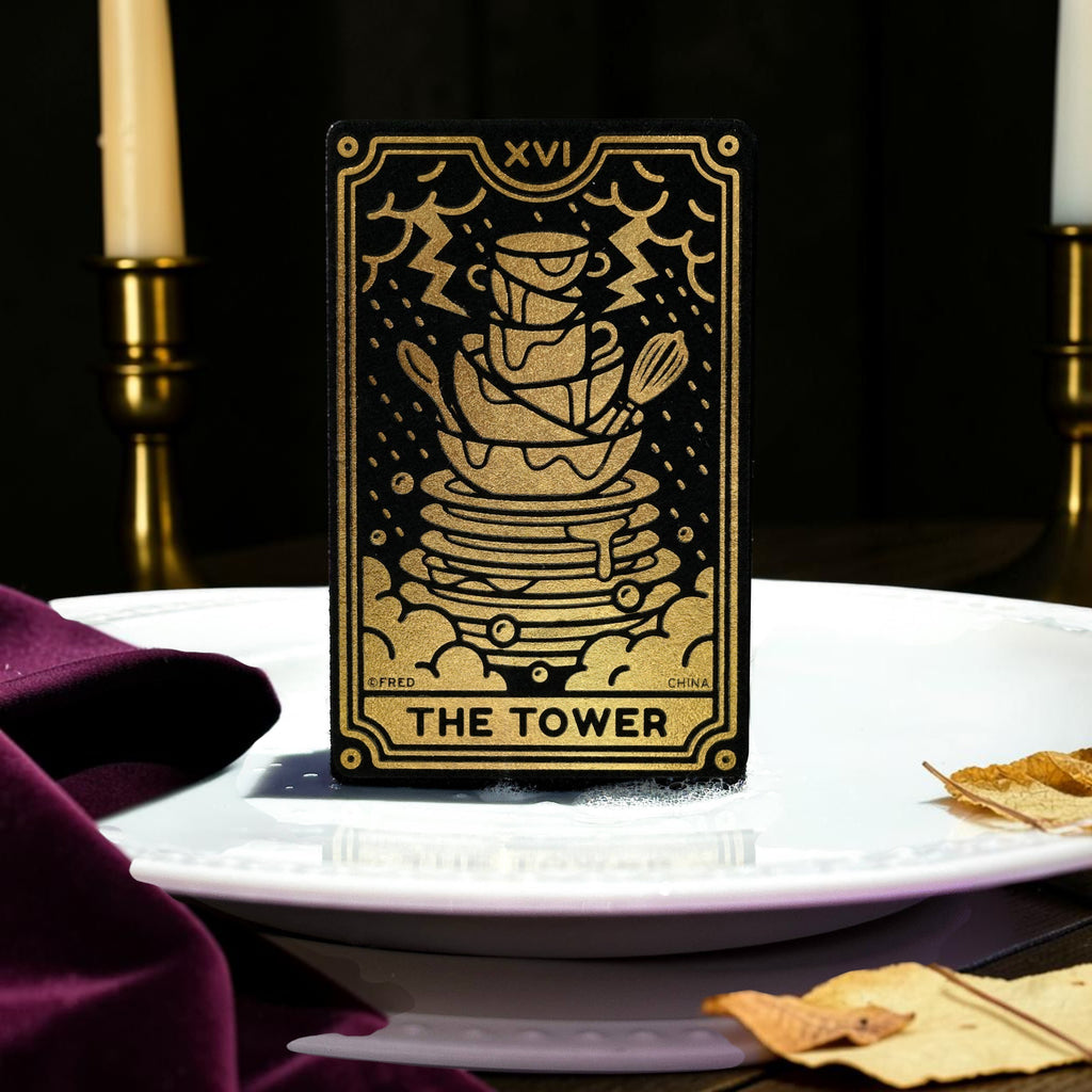 Halloween-Emporium The Tower tarot card kitchen sponge with metallic gold illustration on a black background.