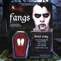 Halloween-Emporium vampire fangs in coffin-shaped packaging with dental putty for a custom fit