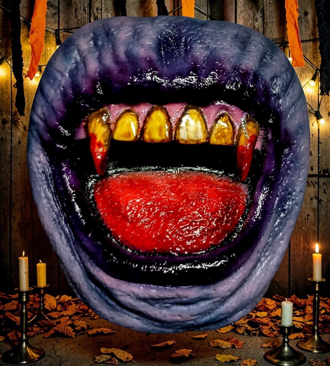 Halloween-Emporium hand-painted resin vampire mouth magnet with yellowed fangs and red gums for gothic decor