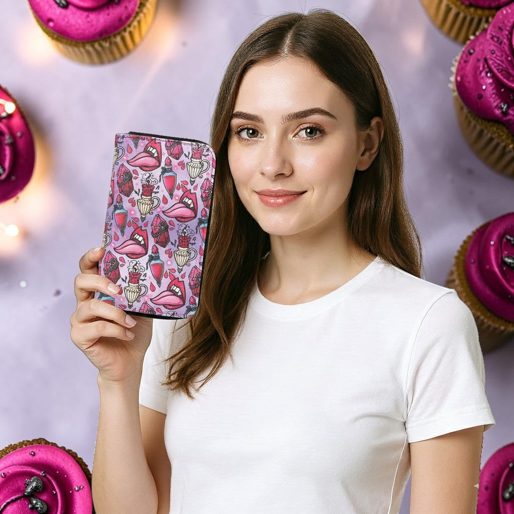 Halloween-Emporium vampire party vinyl wallet with gothic lip and potion print held by a smiling woman