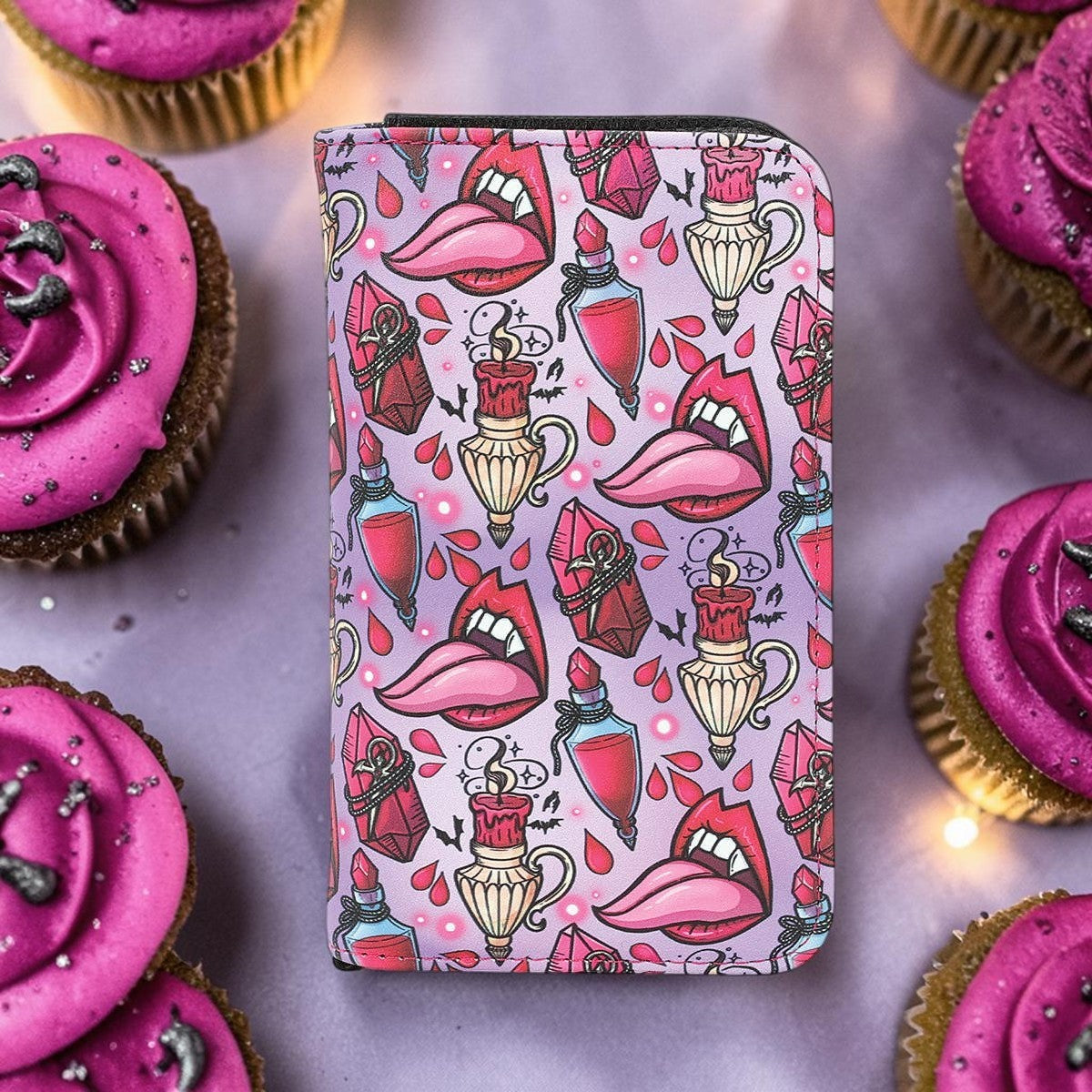 Halloween-Emporium vampire party vinyl wallet with gothic print of lips, potions, and candles on a purple background.