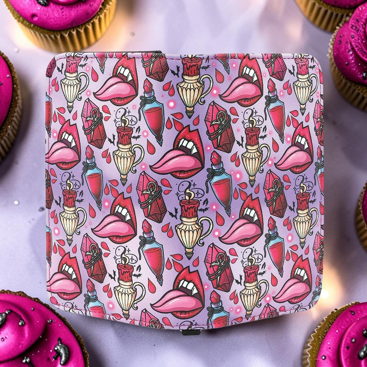 Halloween-Emporium vampire party vinyl wallet featuring a gothic print of lips, potions, and candles on purple.