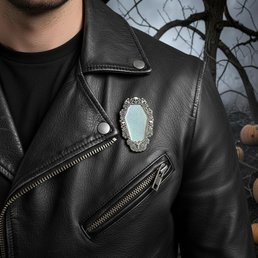 Halloween-Emporium Vincent Price gothic coffin enamel pin attached to a black leather jacket.