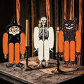 Halloween-Emporium vintage style witch, skeleton, and black cat honeycomb cardstock decorations on a table.