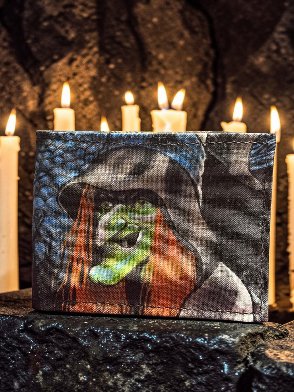 Halloween-Emporium hand crafted wallet featuring a vintage witch illustration on a dark candlelit background