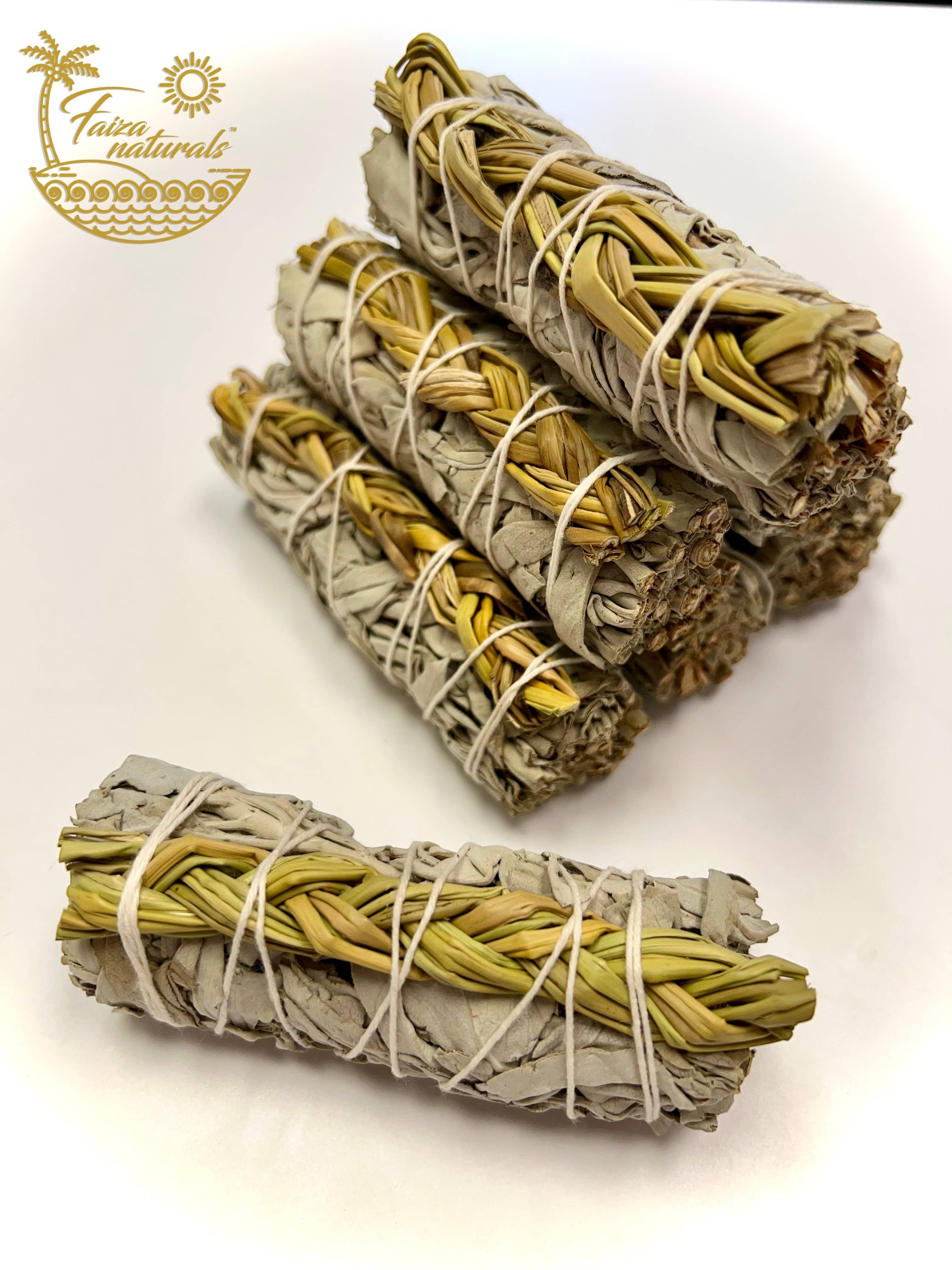 Halloween-Emporium hand-tied smudge bundle featuring California white sage and braided sweetgrass for purification.