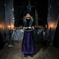 Halloween-Emporium 4-foot Winnie the Witch animatronic in a black and purple gown holding a silver tray