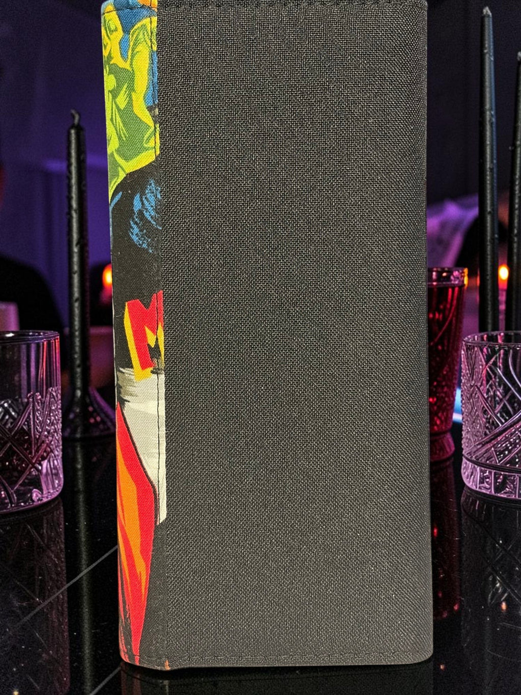 Halloween-Emporium Wolfman clutch wallet featuring a black fabric exterior and vibrant horror comic book art side panel