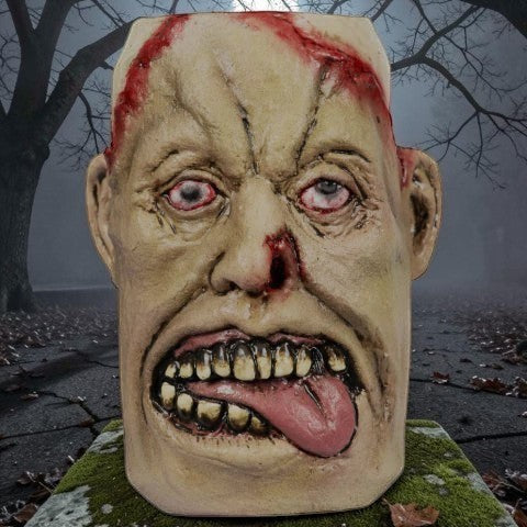 Halloween-Emporium zombie beverage can cover with realistic decaying skin, blood stains, and protruding tongue.