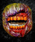 Halloween-Emporium zombie mouth magnet with textured skin, stained teeth, and gruesome purple, green, and red details.