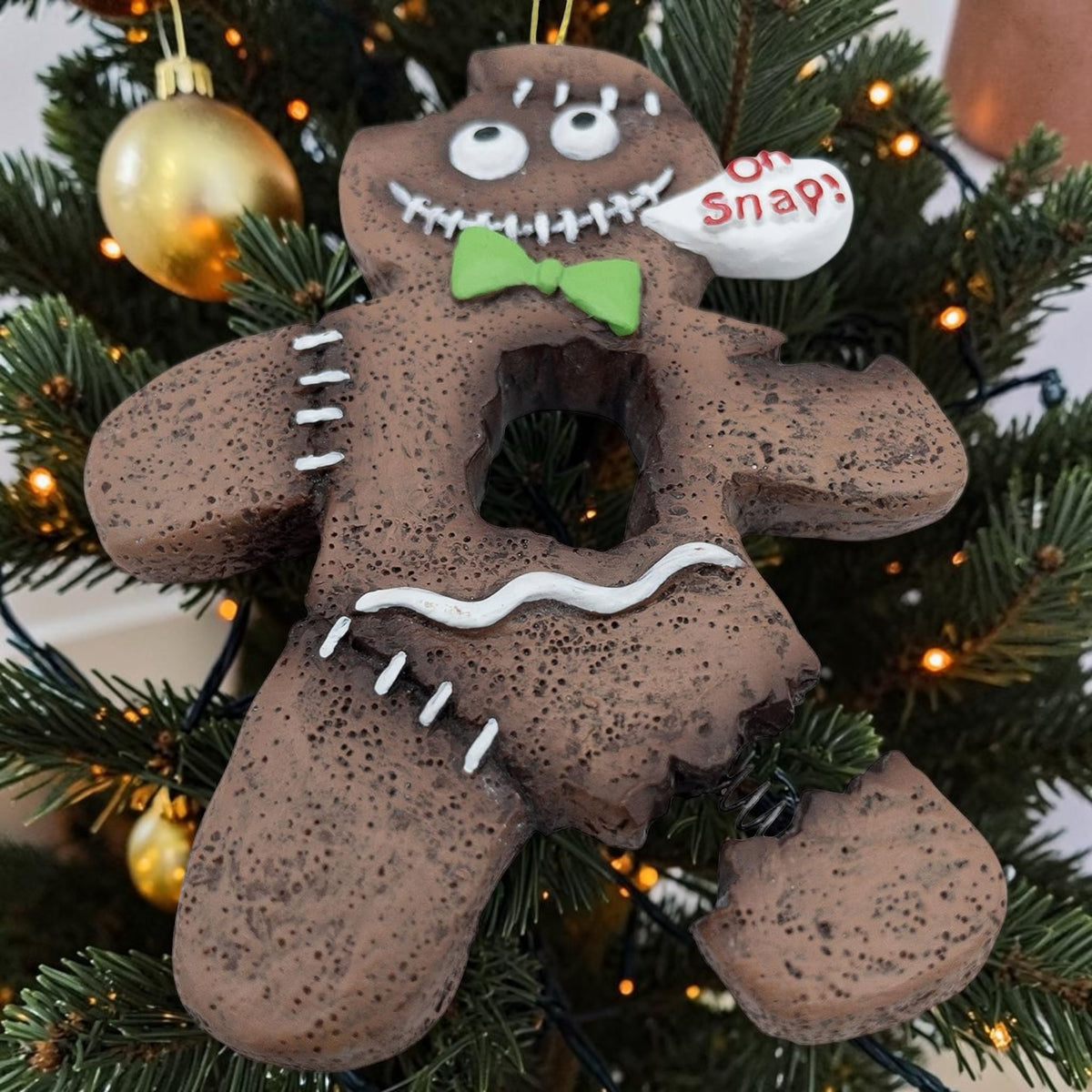 Halloween-Emporium spooky gingerbread man ornament with stitched details, green bow tie, and Oh Snap speech bubble.