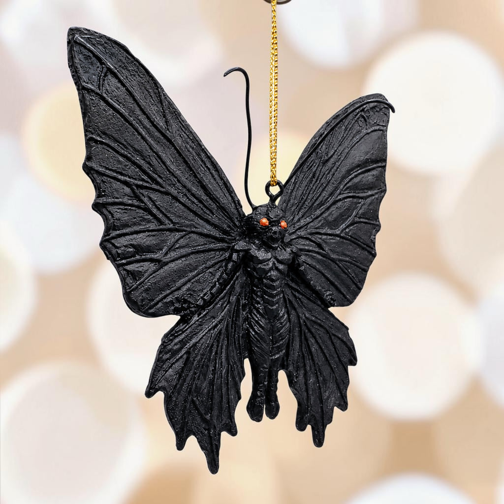 Halloween-Emporium gothic black moth hanging ornament with textured wings and piercing orange eyes.