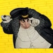 Halloween-Emporium DC Direct Penguin vinyl figure wearing a top hat and black coat against a yellow brick background.